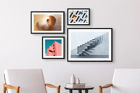 framed prints hung on wall